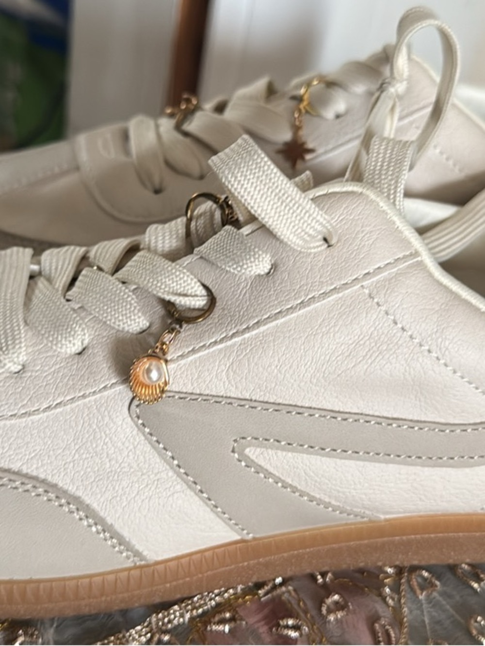 Dolce Vita Cream Leather Sneakers with Gold Pearl Charm